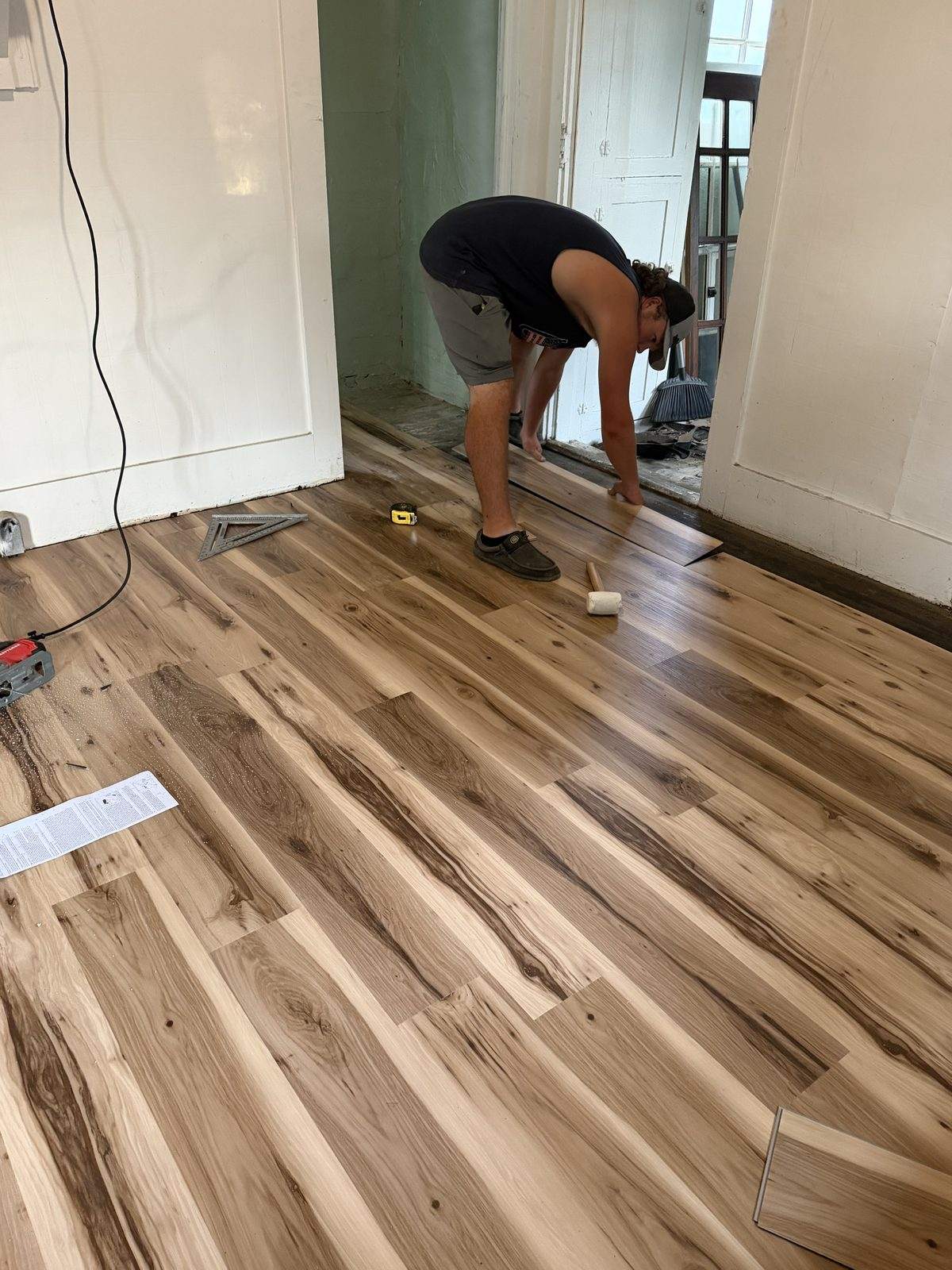 Vinyl plank flooring being installed